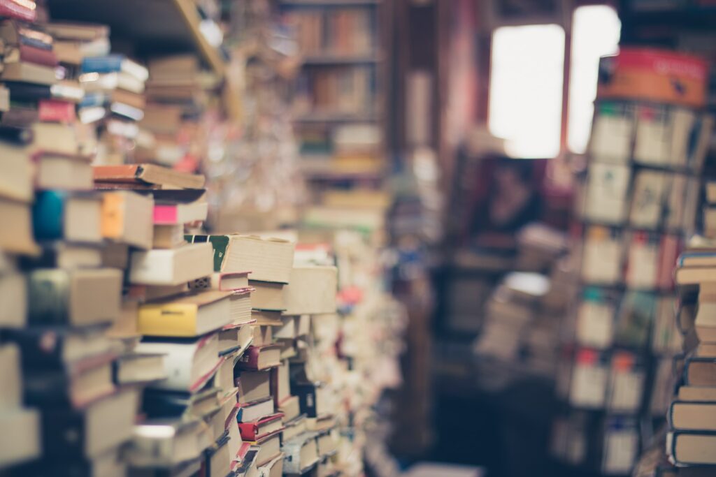 A room filled with piles of old books